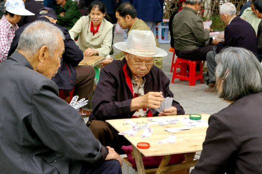 CHINA - MAY 15, Many old people are playing pocker in Guilin, China on 15 May, 2010.