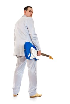 man in white suit with electric guitar look back, white background