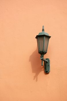 Orange lamp on wall