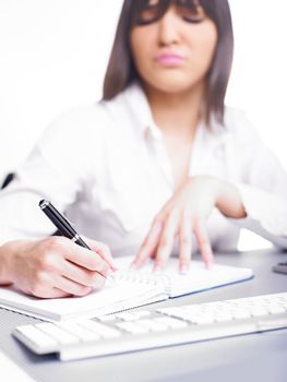 Happy Business Woman Writing in notepad