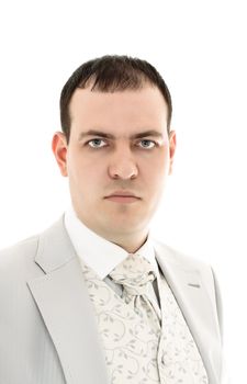 serious young man in wedding suit isolated on white background