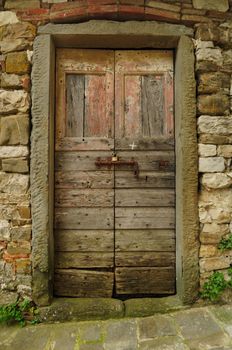 An ancient door in a tuscan village