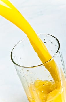 juice is poured into a glass closeup