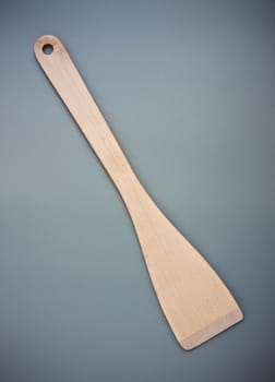 wooden kitchen spatula on grey background