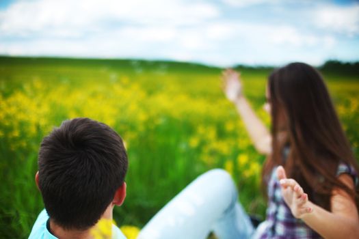 lovers hug on yellow flower field