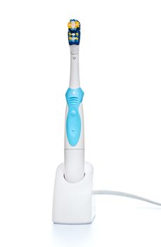 electric toothbrush on stand, front view