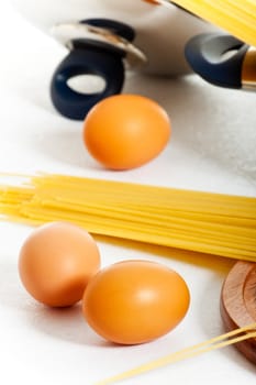 spaghetti and eggs on table