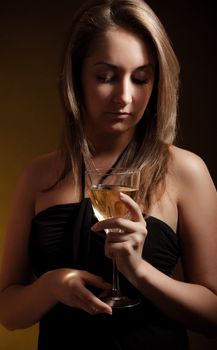 beautiful girl with glass of wine, black background