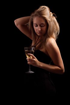 beautiful girl with glass of wine, black background