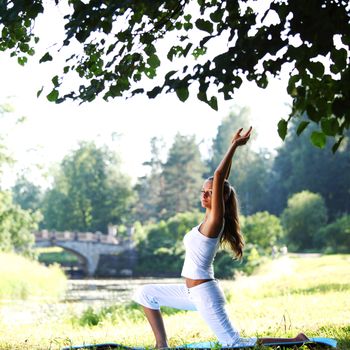 yoga woman on green park background