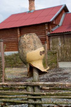 broken jar on village fence