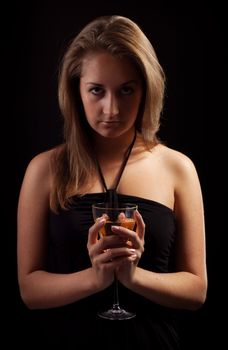 beautiful girl with glass of wine, black background