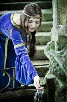 medieval girl next ancient spring, textured