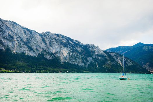 Yacht on a blue alpine lake. Salzkammergut. Austria