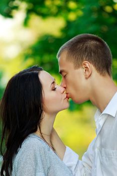 kissing couple in the park, closeup