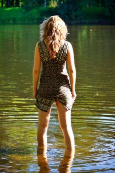 beutiful girl stand in river