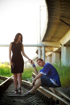 young couple on rails