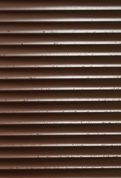 Closeup of Brown Blinds With Rain Drops