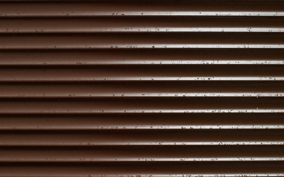 Closeup of Brown Blinds With Rain Drops