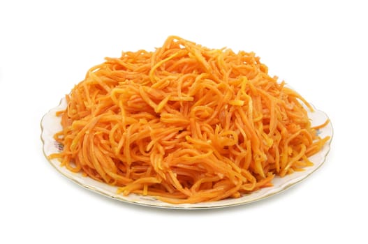spicy carrot salad on a plate on a white background