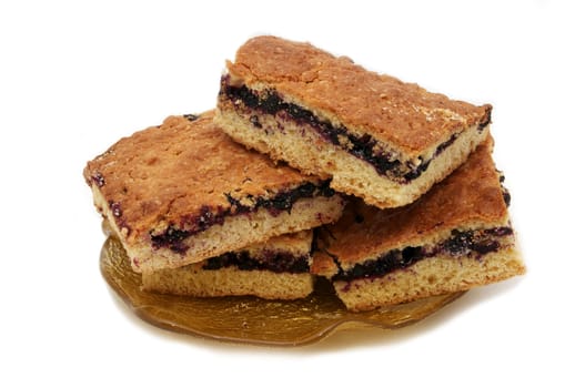 pieces of the pie with blueberries on a plate on a white background