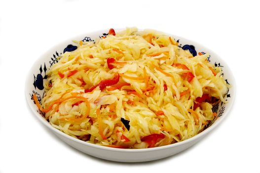 a large plate of salad with cabbage on a white background