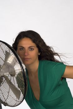 Woman getting as close as possible to a fan