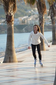 Woman enjoying a sunny afternoon on her rollerblades