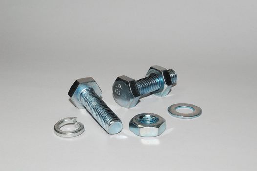 A set of shiny metal nuts and bolts for do-it-yourself  stuff or repairing/replacing old parts.