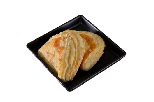 Puff pastry with tuna on the plate , white background