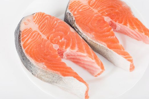 Red fish steak isolated on a white background
