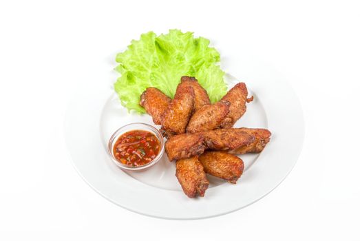 chicken roasted wing dish with sauce on a white background