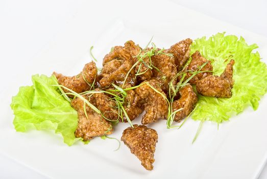 Gourmet fish fillet baked at caramel isolated on a white
