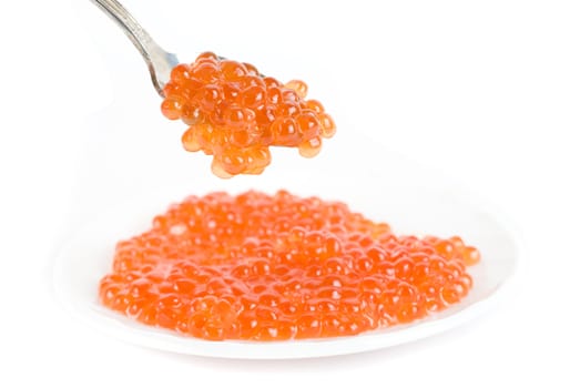 red caviar with spoon on a white background