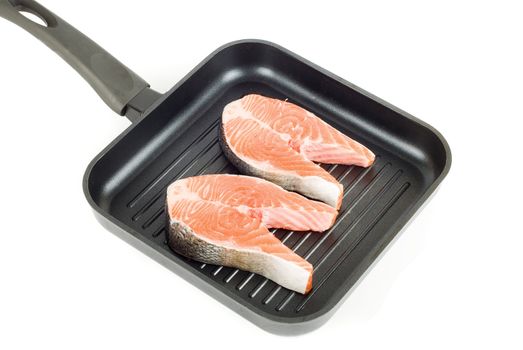 trout steak at grill pan on a white background
