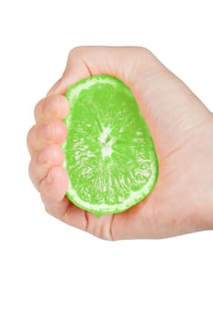 Fresh squeezed green lime with hand isolated on a white background
