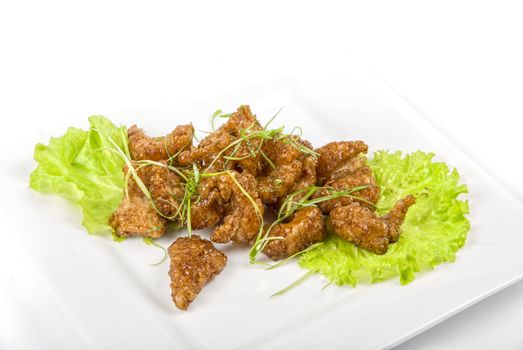 Gourmet fish fillet baked at caramel isolated on a white
