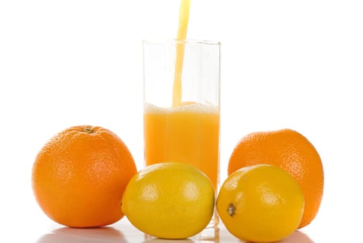 Fresh squeezed pouring citrus juice with fruits isolated on a white background

