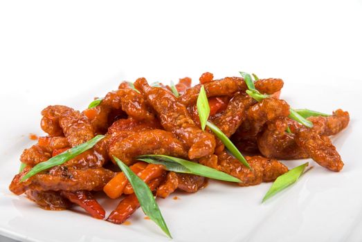 Roasted Beef at sour-sweet sauce on a white background