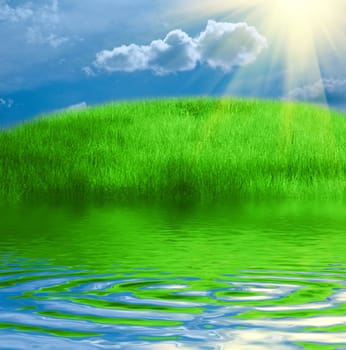 Green grass, blue dramatic sky and white clouds