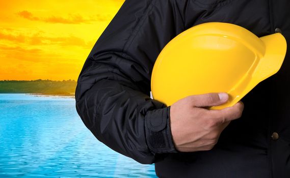 Builder on beauty sunset on lake, and orange sky
