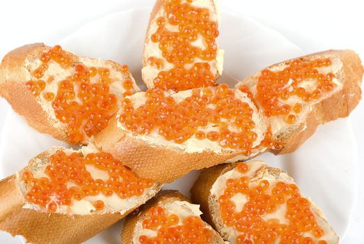 Sandwiches caviar at plate isolated on a white background