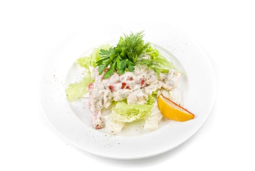 Tasty salad of seafood and vegetable dish close up on a white background