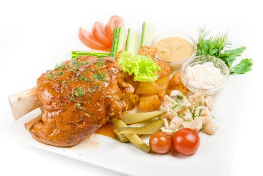 Tasty pork brisket dish with vegetables on a white background