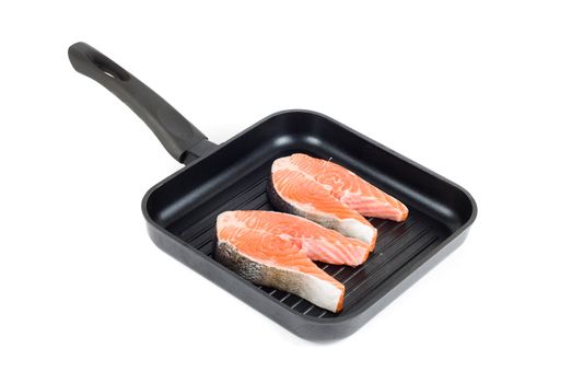 trout steak at grill pan on a white background