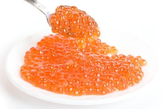red caviar with spoon on a white background