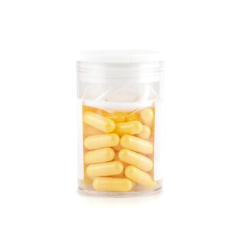 yellow pills isolated on a white background