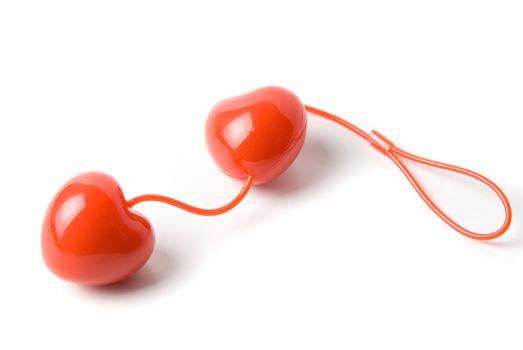 Red vaginal balls as heart isolated on a white
