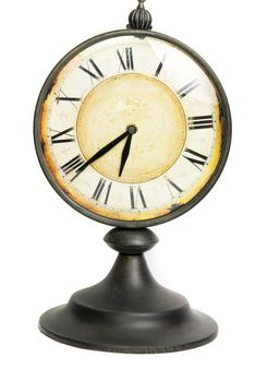 An old vintage clock isolated on a white background