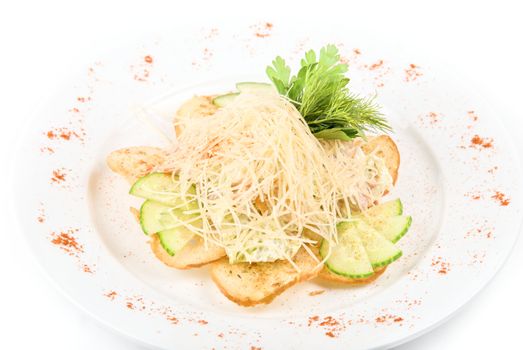 Tasty Salad dish with dried crust, vegetables, greens and cheese on a white background